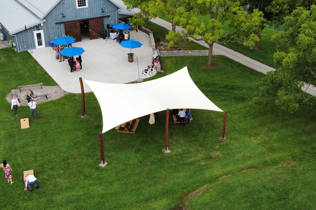 Shade Structures Improve Outdoor Spaces: 6-Post Super Shade Triangle by Sun Shade Co