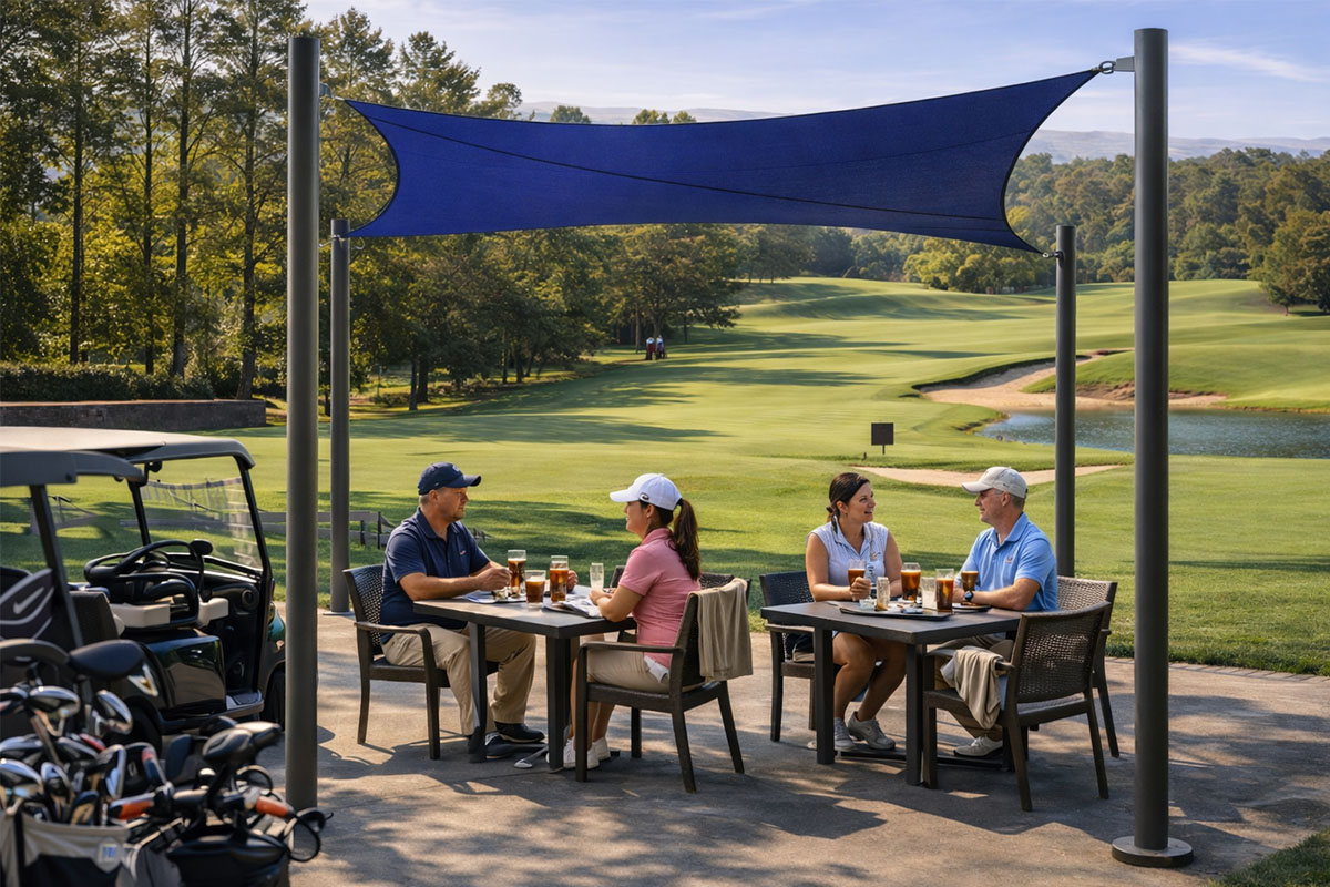 A aquatic blue 4 Post Shade structure providing focused shade for golfers dining on a patio overlooking a professional golf course.